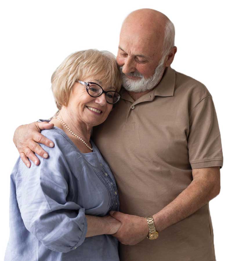 Elderly couple embracing and smiling, depicting love and care.