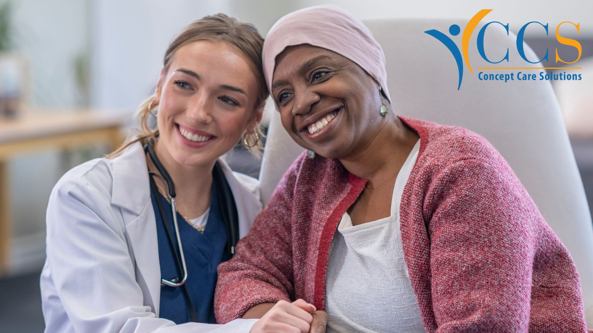 A nurse and a patient smiling and posing for a photo together.