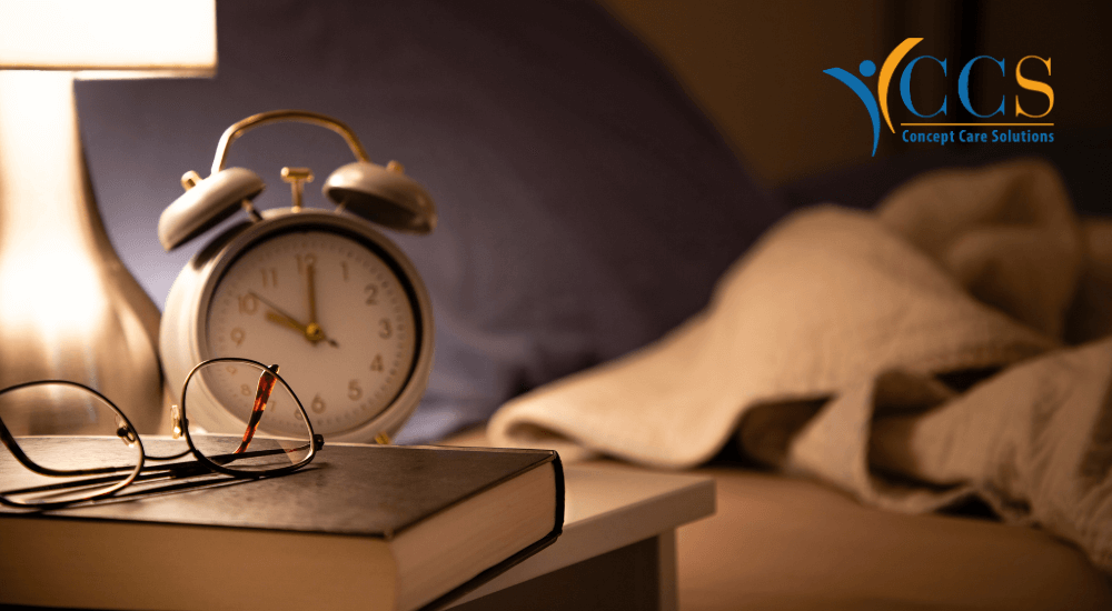 A bedside scene featuring an alarm clock, glasses, and a book, symbolising the importance of overnight care services in providing comfort and security for seniors.