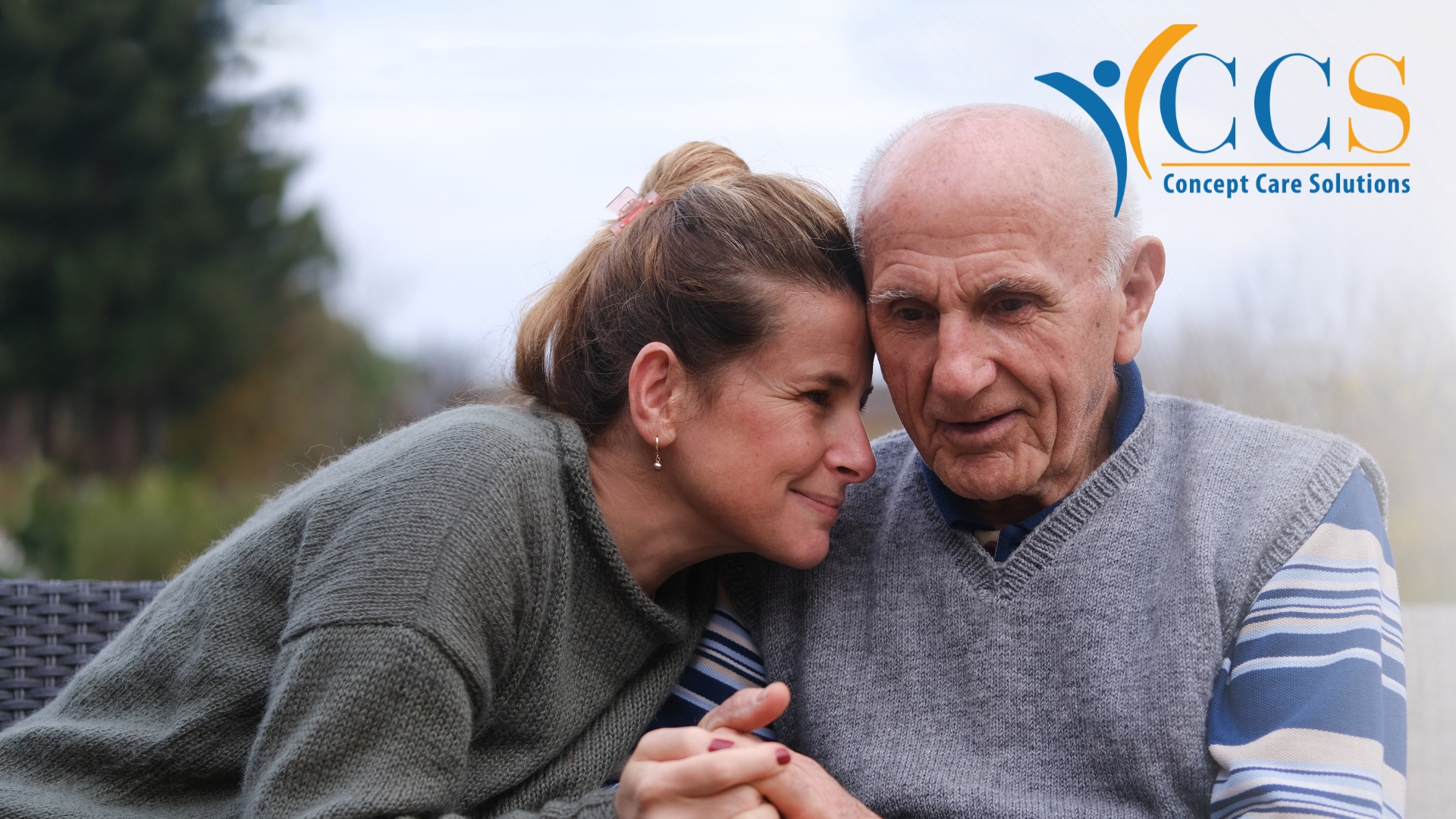 Woman supporting her elderly father at home, highlighting menopause and caring responsibilities.